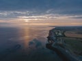 Drone aerial shot of Remains of Reculver church towers at early october sunrise early october sunrise