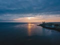 Drone aerial shot of Remains of Reculver church towers at early october sunrise early october sunrise