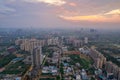 drone aerial shot showing busy traffic filled streets between skyscrapers filled with houses, homes and offices with a Royalty Free Stock Photo