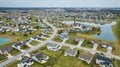 Drone aerial of suburban Midwest American neighborhood houses with ponds