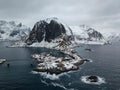 Drone aerial top view of Lofoten Islands in Norway. Winter Landscape with traditional wooden red fisherman huts and this beautiful Royalty Free Stock Photo