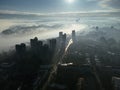 Drone aerial view of Belgrade city in the smog and fog in the morning. Zemun and New Belgrade district, Serbia, Europe. Royalty Free Stock Photo