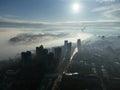 Drone aerial view of Belgrade city in the smog and fog in the morning. Zemun and New Belgrade district, Serbia, Europe. Royalty Free Stock Photo