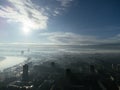 Drone aerial view of Belgrade city in the smog and fog in the morning. Zemun and New Belgrade district, Serbia, Europe. Royalty Free Stock Photo