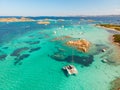 Drone aerial view of catamaran sailing boat in Maddalena Archipelago, Sardinia, Italy.