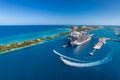 The drone aerial view of cruise ships in the clear blue Caribbean ocean docked in the port of Nassau, Bahamas