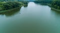 Drone aerial view fisherman is fishing sitting on an inflatable boat in lake