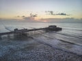 Drone aerial view landscape image of Worthing pier on Sussex coast in England at dawn Royalty Free Stock Photo