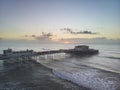 Drone aerial view landscape image of Worthing pier on Sussex coast in England at dawn Royalty Free Stock Photo