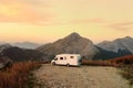 Drone aerial view of parked big modern camper motorhome. Family vacation travel RV. Bicycles attached to a caravan. Travel and