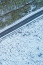 drone aerial view of a snowy mountain road, winter landscape Royalty Free Stock Photo