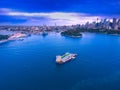 Drone Aerial view of Sydney Harbour Sydney CBD NSW Australia. cloudy dark skies, clear turquoise waters. Royalty Free Stock Photo