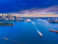 Drone Aerial view of Sydney Harbour Sydney CBD NSW Australia. cloudy dark skies, clear turquoise waters. Royalty Free Stock Photo