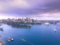 Drone Aerial view of Sydney Harbour Sydney CBD NSW Australia. cloudy dark skies, clear turquoise waters. Royalty Free Stock Photo