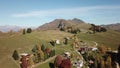 Drone aerial view to the Farno mountain and Orobie Alps, Italy, during fall season