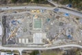 Drone aerial view to huge building construction site with digger crane Royalty Free Stock Photo