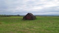 Drone Around Turf House Iceland. Low Aerial Around Geirsstadakirkja Hut Green Grass Clouds