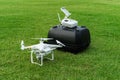 Drone and backpack on grass