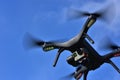 Drone with camera over blue sky. Royalty Free Stock Photo