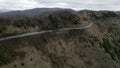 Drone captures a mountain with a camped motorcyclist