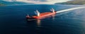 Drone captures tug boat towing empty barge at sea copy space image