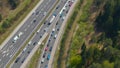 DRONE: Cars driving along congested entry lane and joining the highway traffic.