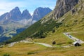 DRONE: Colorful sports cars and motorbikers cruising down winding mountain road.