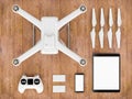 Drone with control devices on light coloured wood. 3D illustration.