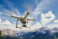 Drone copter flying with camera in mountains Royalty Free Stock Photo