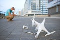 Drone crash. Fallen damaged quadrocopter in city Royalty Free Stock Photo