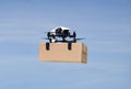 Drone delivering box package on delivery flight