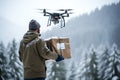 Drone delivery of cargo through a winter forest in snowfall Royalty Free Stock Photo