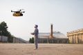 drone delivery to distribution factory where operator awaits