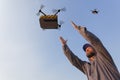 drone delivery to distribution factory where operator awaits