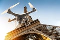 Drone with digital camera flying over Tour Eiffel