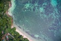 Drone field of view of fishing boats and pristine coastline and forest Praslin, Seychelles