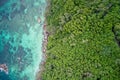 Drone field of view of rocky coastline and cliffs meeting sea Praslin, Seychelles