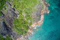 Drone field of view of spectacular blue coastline with waves and forest on Curieuse Island, Seychelles