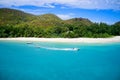 Drone field of view of speeding boat in turquoise water Curieuse Island, Seychelles