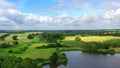 Drone flies over a lake landscape in summer when the weather is fine 2