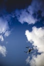 Drone in flight with cloudy sky Royalty Free Stock Photo