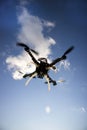 Drone in flight with cloudy sky Royalty Free Stock Photo