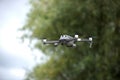 Drone in flight on blurred nature background Royalty Free Stock Photo