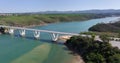 Drone flight over the freeway bridge over the Rio Mira near the town of Bairro Monte Vistoso