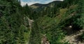 Drone flight in summer over mountain stream in the Nockberge