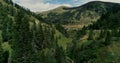 Drone flight in summer over mountain stream in the Nockberge