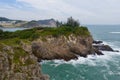 Drone fly over ocean wave crash on island cliff