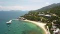 Drone fly over a spectacular beach resort in a tropical island in Asia.