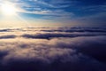 Drone flying above clouds with a beautiful sun in the sky Royalty Free Stock Photo