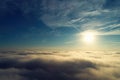 Drone flying above clouds with a beautiful sun in the sky Royalty Free Stock Photo